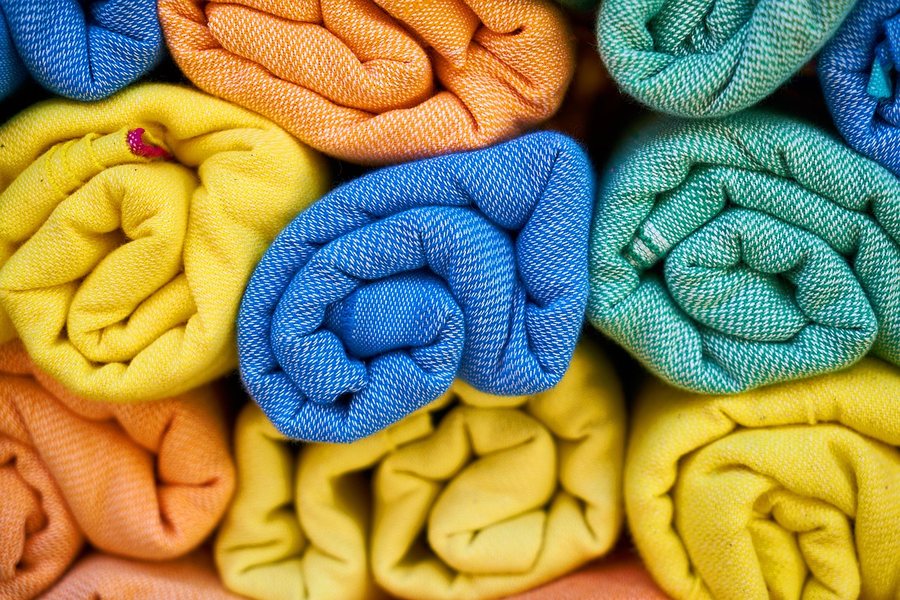 Rolled knitwear in several colours.
