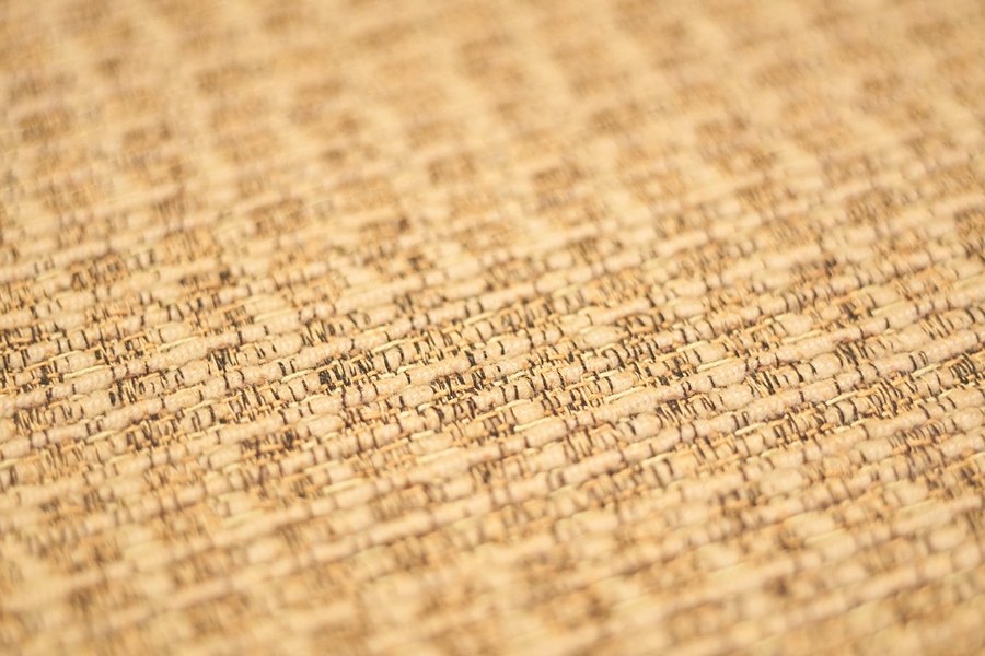 A close-up of a beige woven cotton.