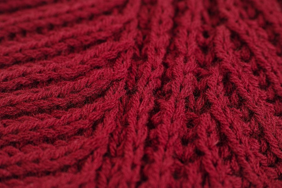 A close-up of a red cable knit.