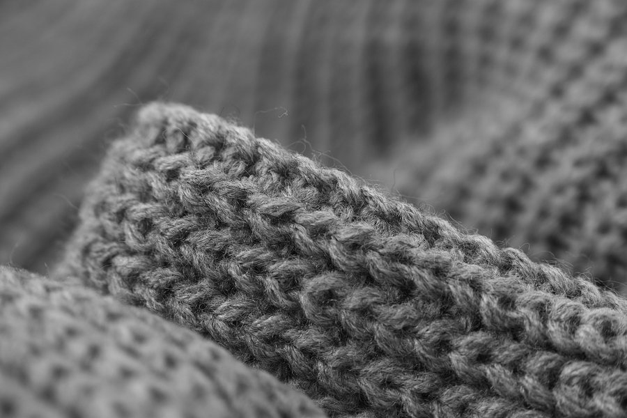 A ribbed grey knit cuff.