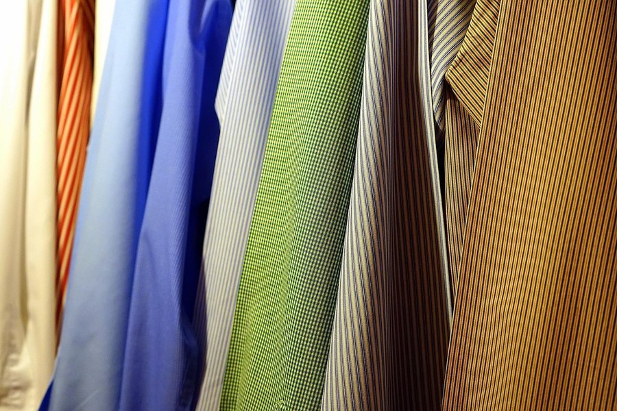 Shirts hanging on a rail.