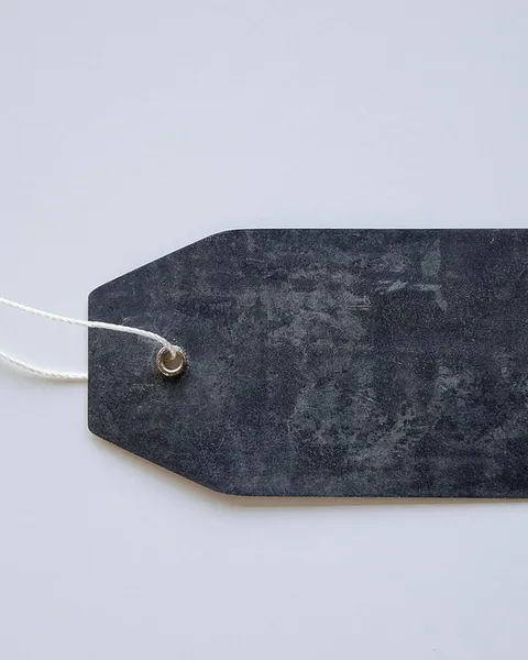 A black garment care tag.