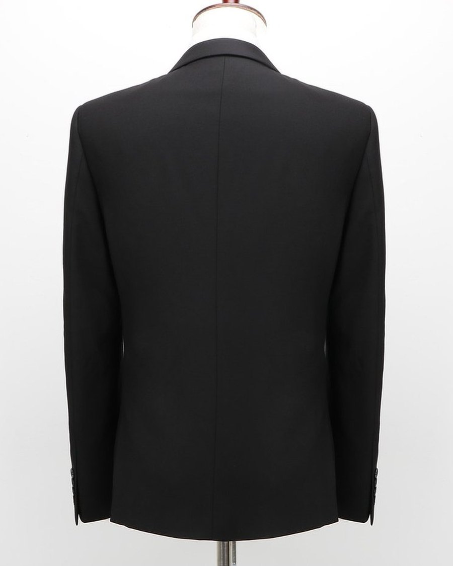 A black blazer photographed front-on against white.