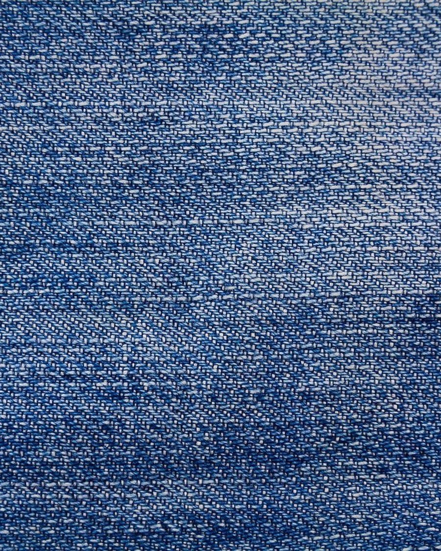 The weave of raw indigo denim.