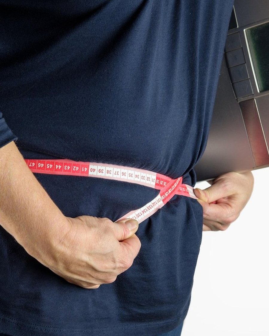 A tape measure around a waist.